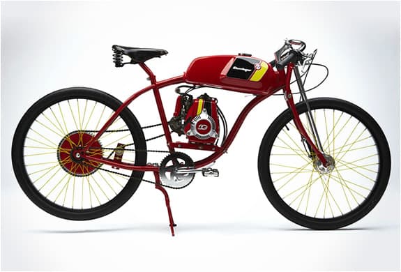 A red Derringer board-track-style bike with yellow-spoked wheels